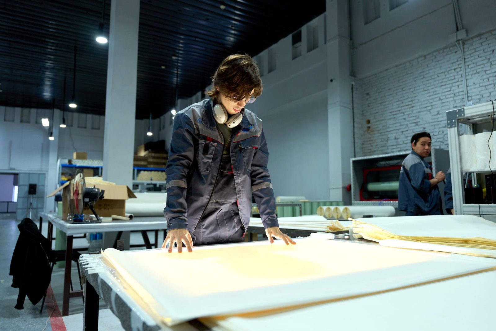 Quality inspector checking finished canvas boards