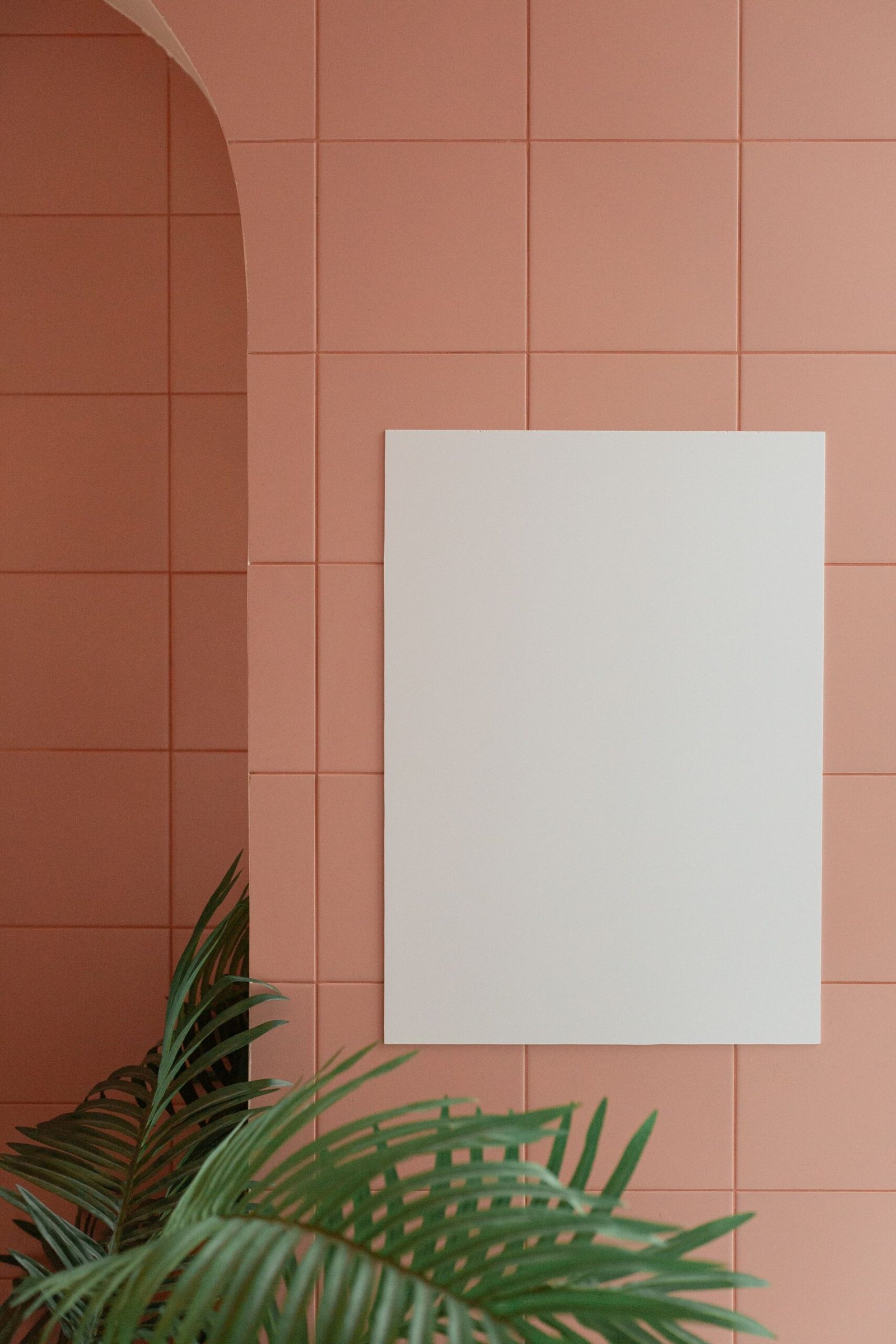 Blank stretched canvas leaning against a wall